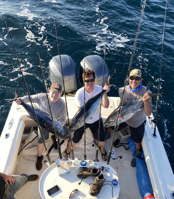 Three people fishing in San Diego