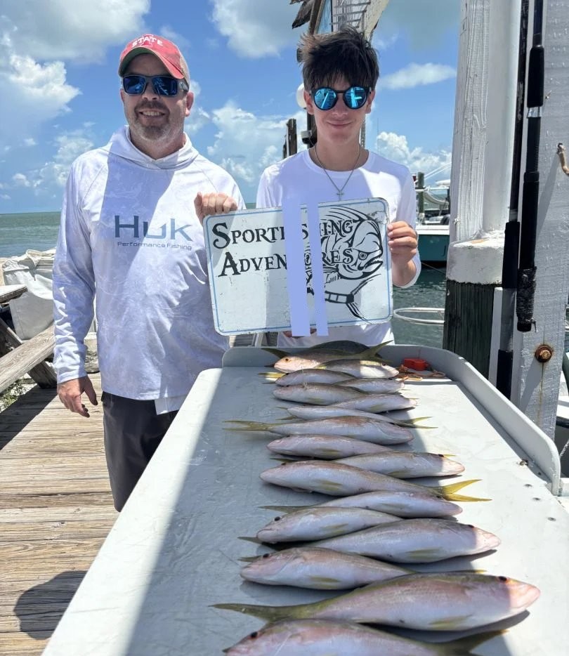 Successful fishing charter in Marathon FL showing multiple fish species laid out on boat deck