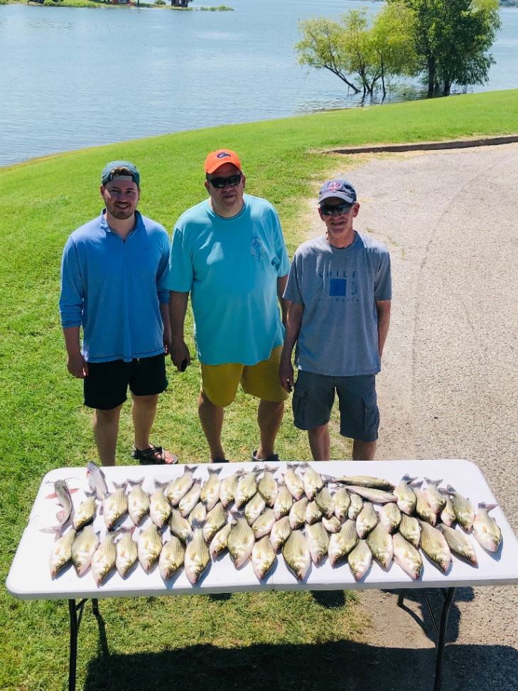3 people enjoying fishing trip in Frisco