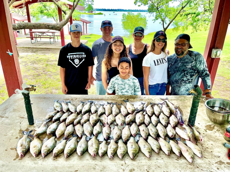 A group of 7 people enjoying a fishing trip in Frisco