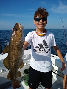 A person holding a fishing rod in New Jersey