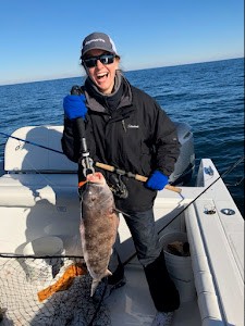 Single person holding fishing rod in Brick Township
