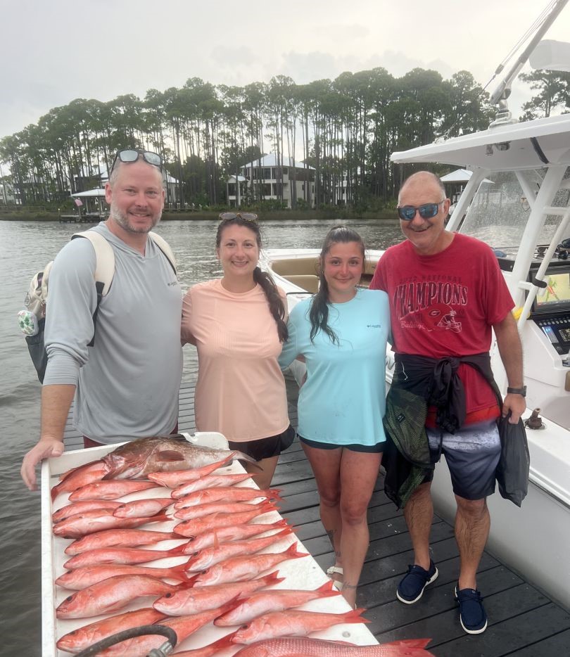 Red grouper fishing catch displayed on boat deck in Santa Rosa Beach FL