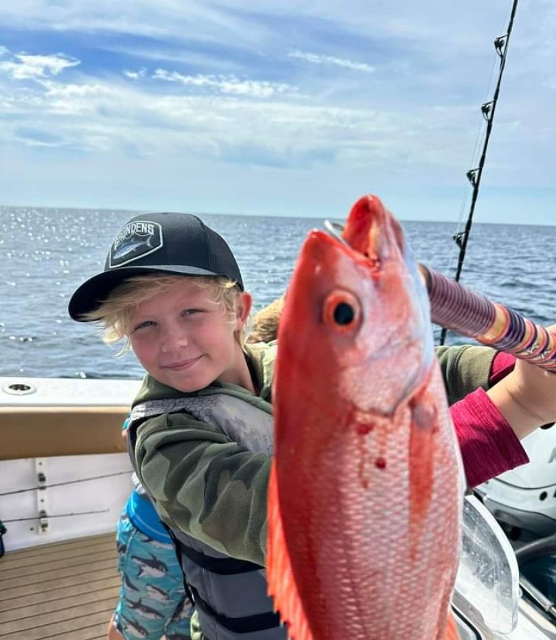 Red snapper catch displayed on fishing charter boat deck in Santa Rosa Beach FL