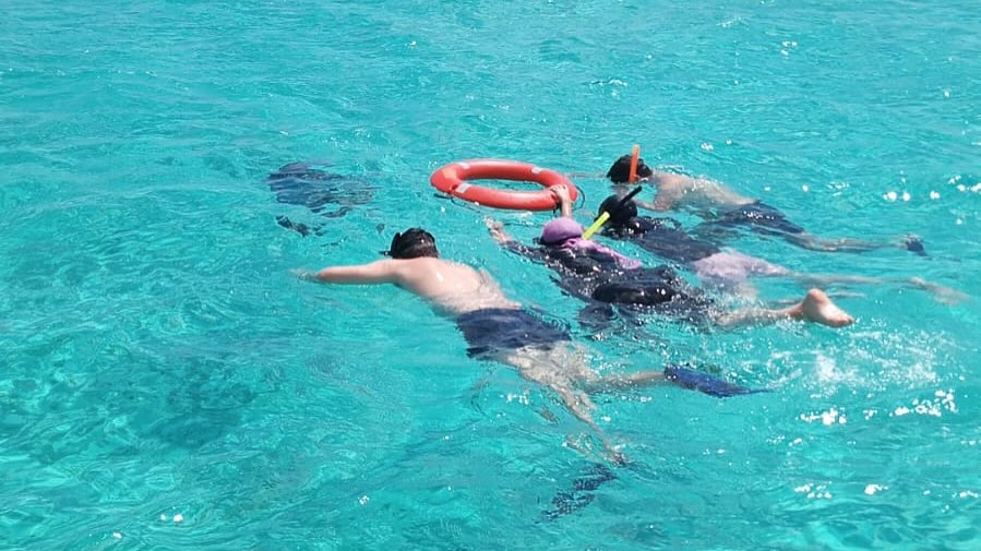 Cozumel snorkeling boat trip with Captain Manny Pool, crystal clear waters, Prowler 22' boat