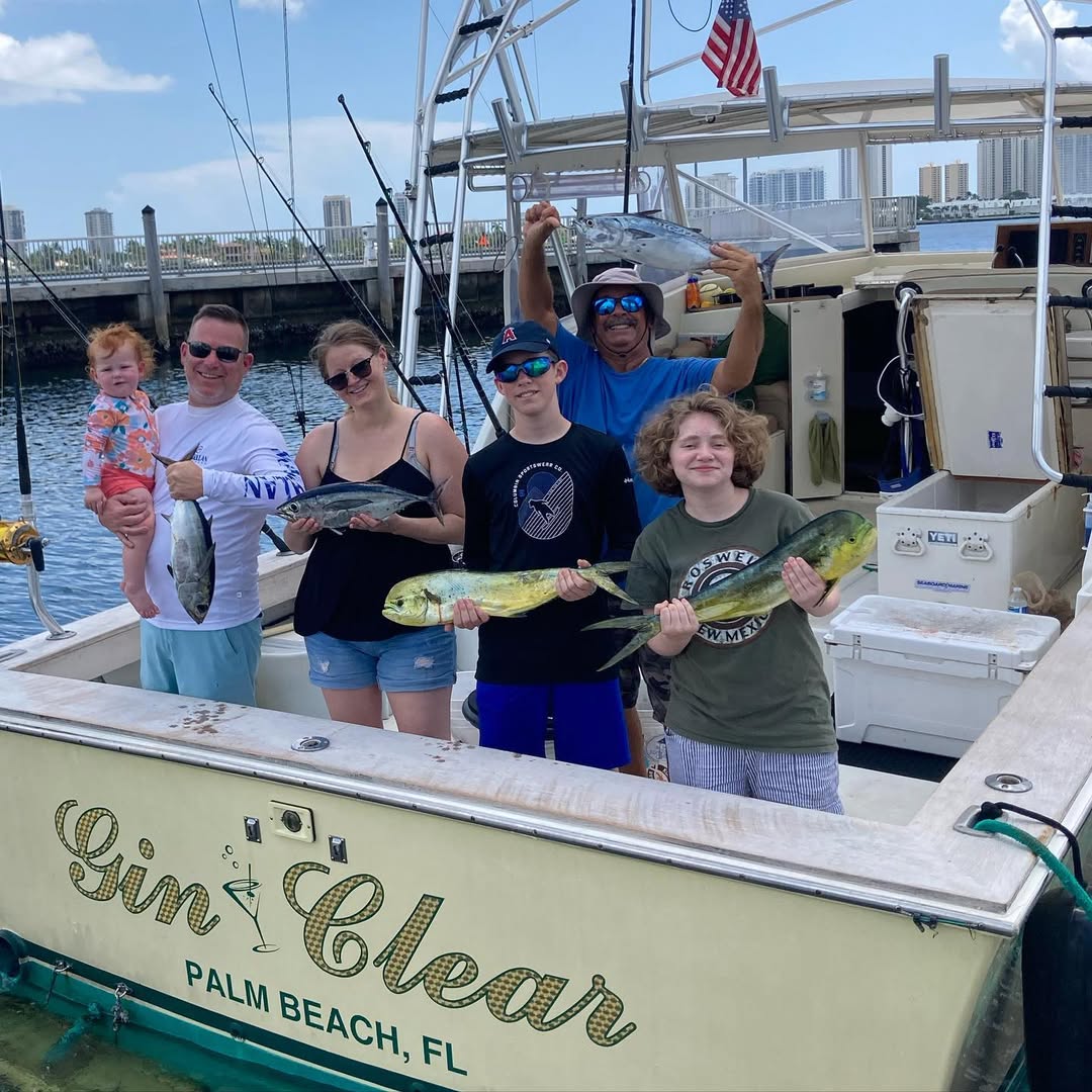 Family fishing charter boat in West Palm Beach with kids and adults on deck