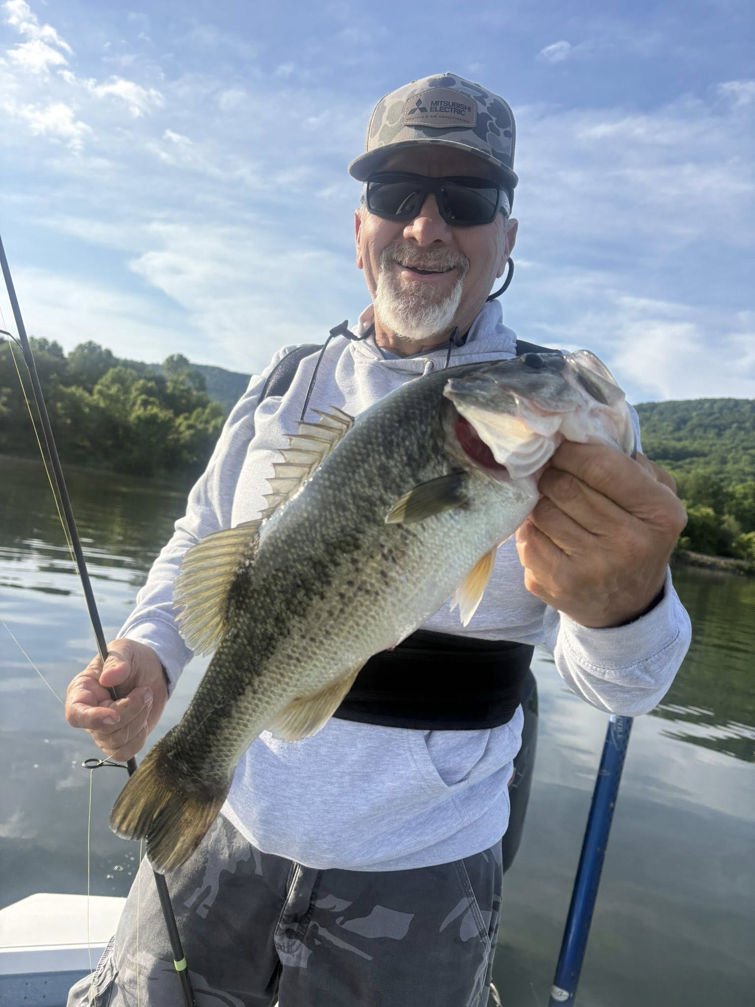 Angler holding large bass caught while fishing in Chattanooga TN