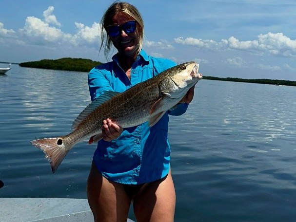Family fishing charter boat in Crystal River Florida waters with captain and guests