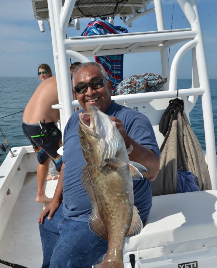 Two anglers enjoying a fishing trip at Bradenton Beach