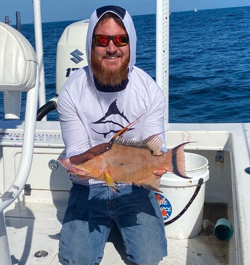 Fisherman catching a hogfish in Florida