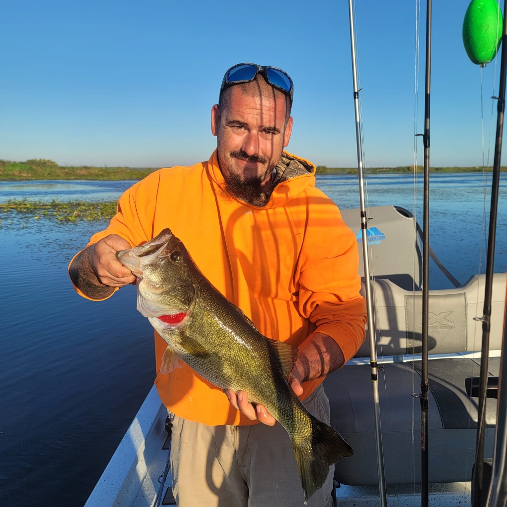 Fisherman with a 18-inch catch in Fellsmere