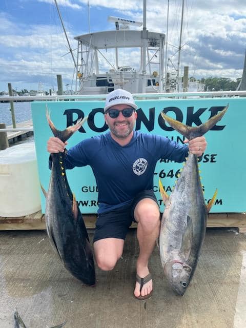 Two big fish caught by a person in Wanchese