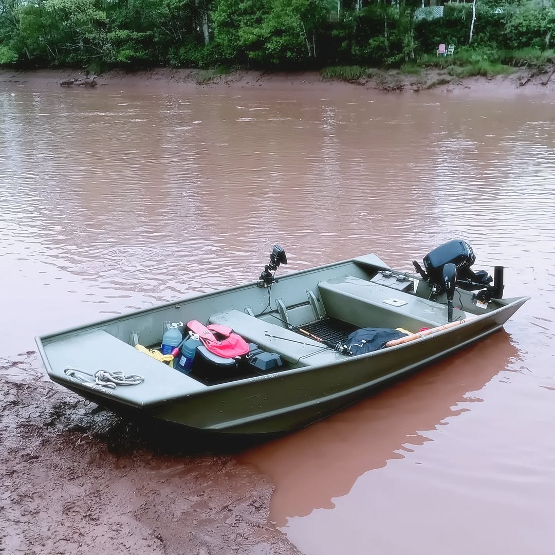 Fishing boat with live sharksucker on muddy water in Lantz NS