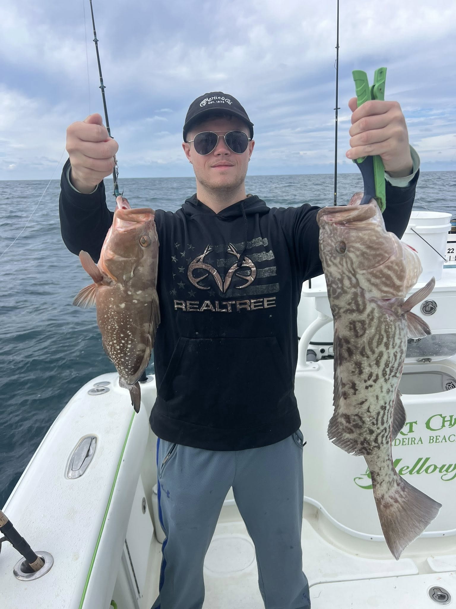 Two gag grouper fish caught during a fishing tour on Treasure Island