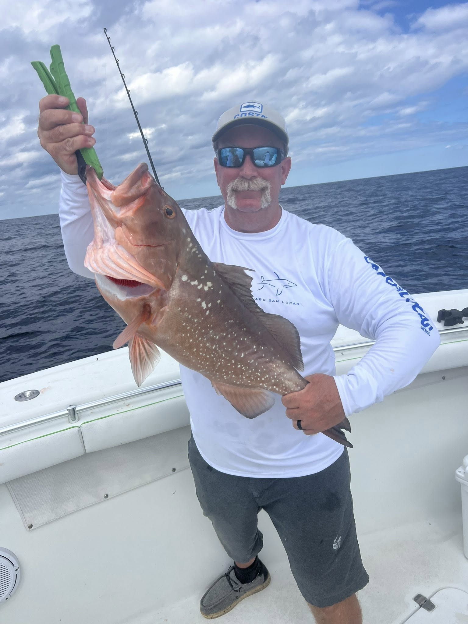 A person enjoying a fishing cruise on Treasure Island