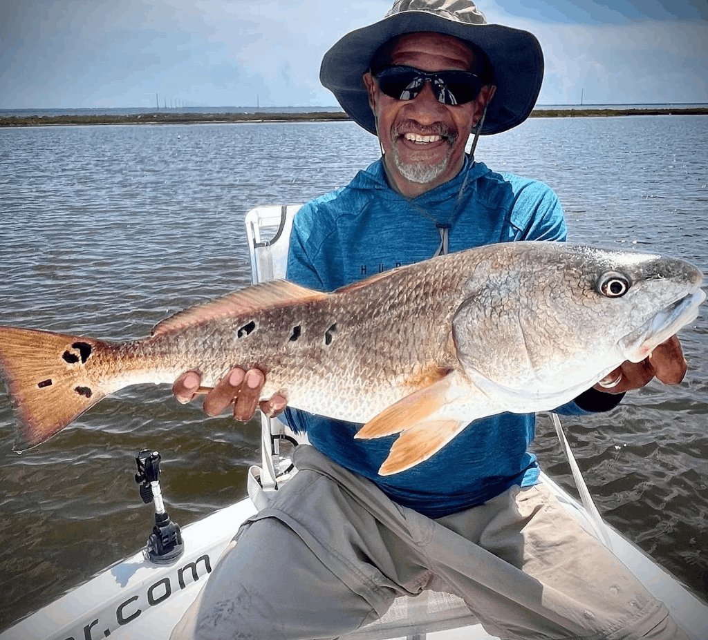 A fisherman catches a big 29-inch fish in Eastpoint