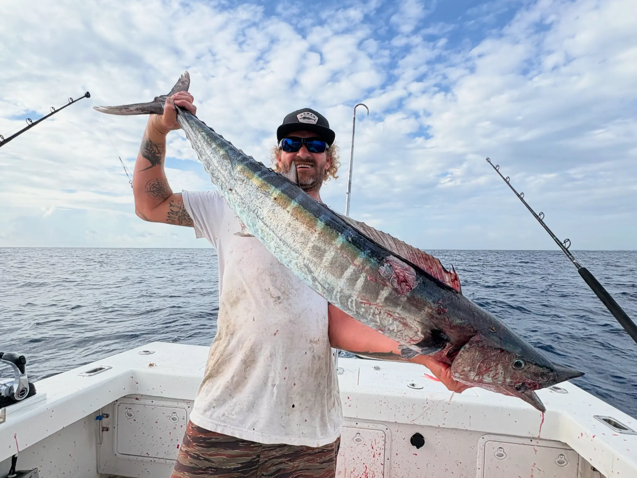 8 hour offshore fishing charter boat in Boynton Beach waters with fishing equipment ready