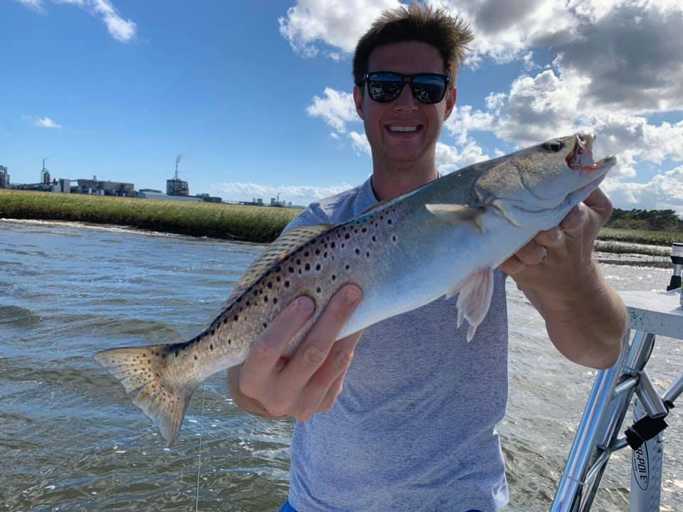 Angler with a large Atlantic salmon caught while fishing in Fernandina Beach