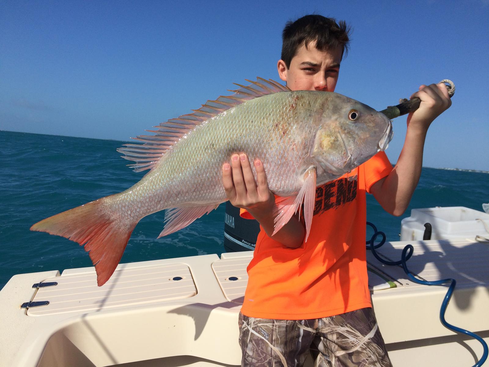 Angler with a 30-inch fish, fishing in Marathon