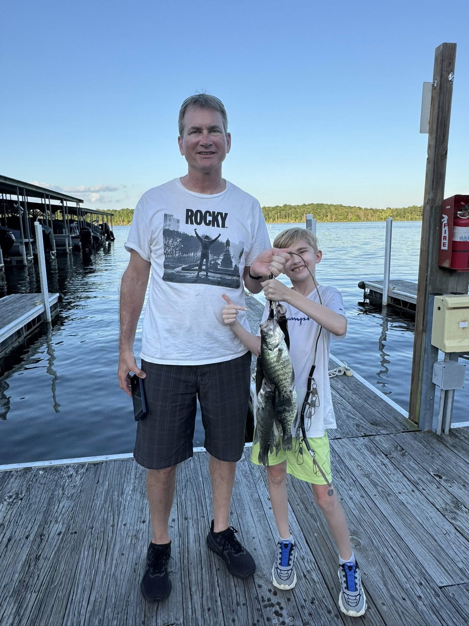 Freshly caught fish displayed on wooden dock at Sand Springs OK marina