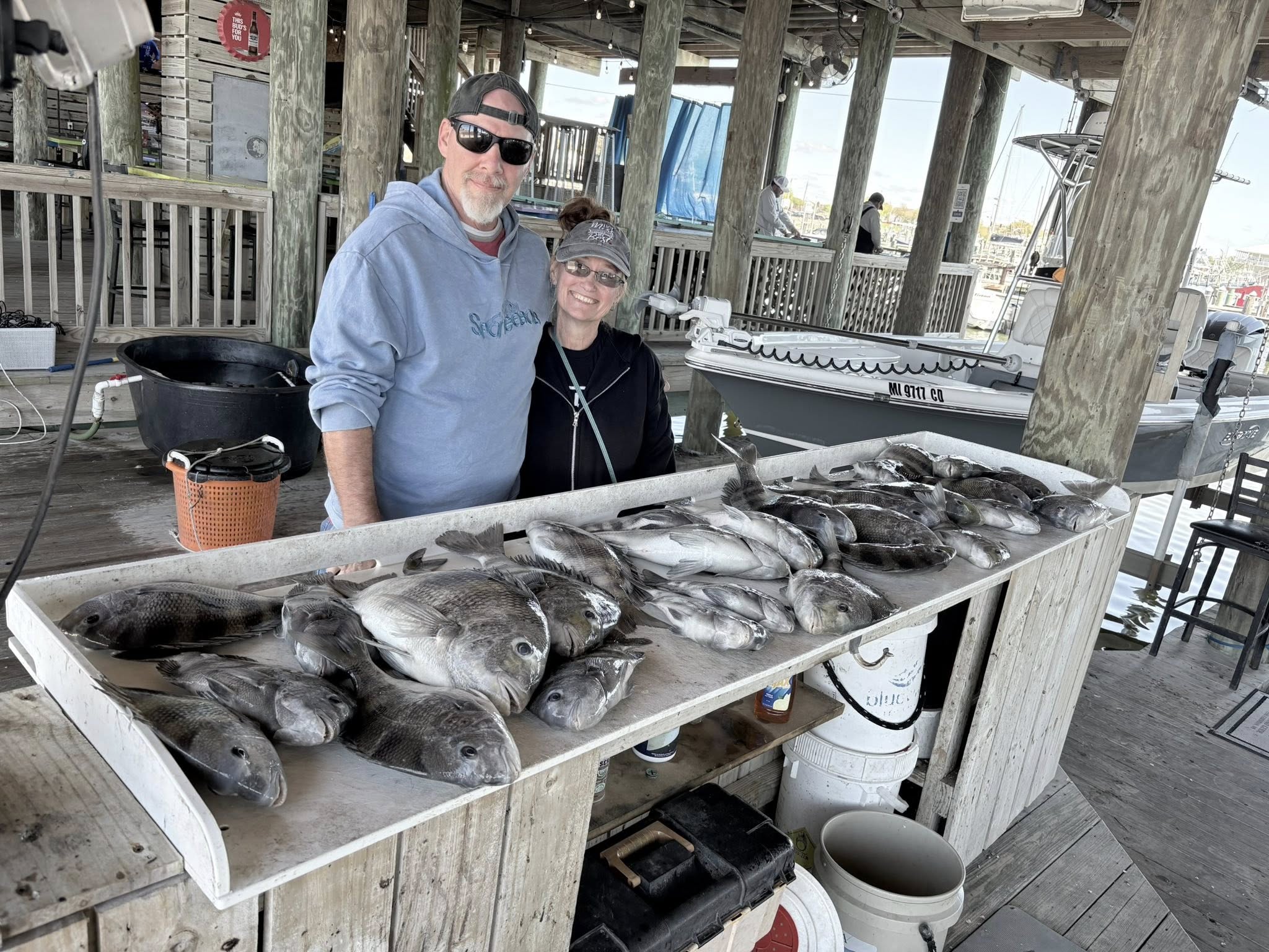 Large catch of fish displayed on cleaning table at fishing dock in Bay St. Louis MS