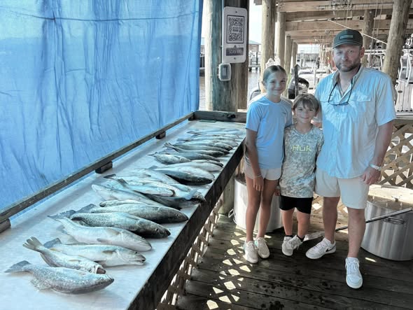 Fishing charter catch display showing multiple fish laid out on boat deck in Bay St. Louis MS