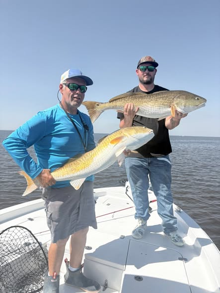 Two large redfish caught during fishing trip in Bay St. Louis MS