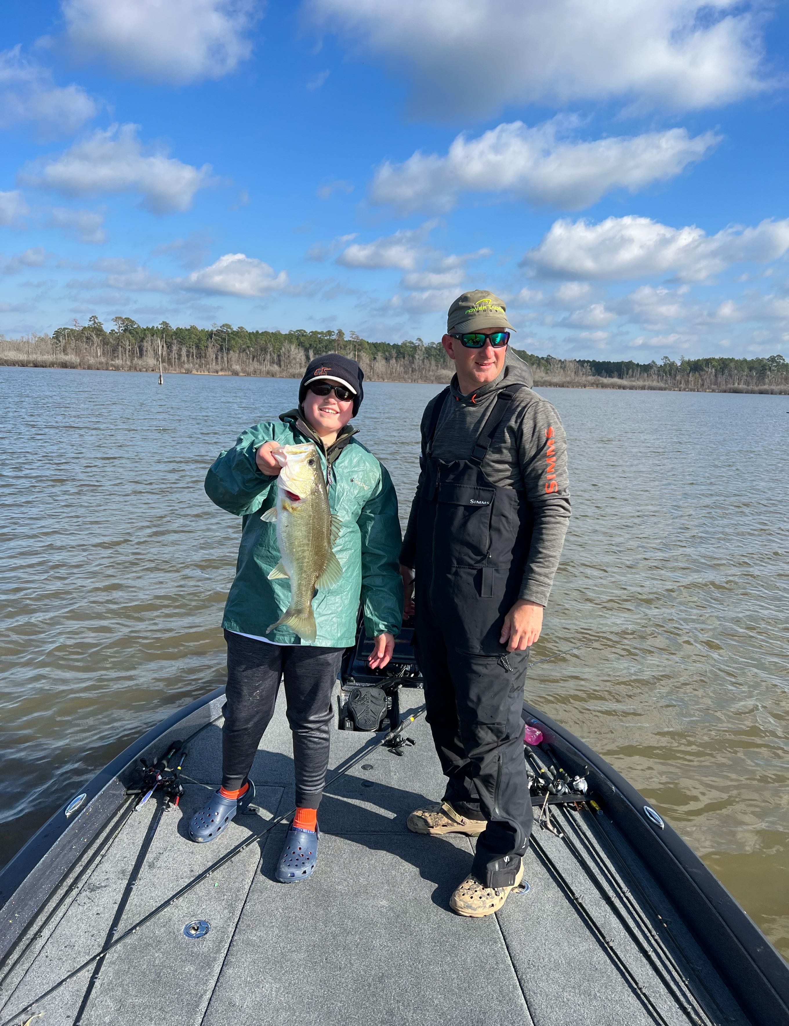An angler holding a Florida Bass fish in Brookeland