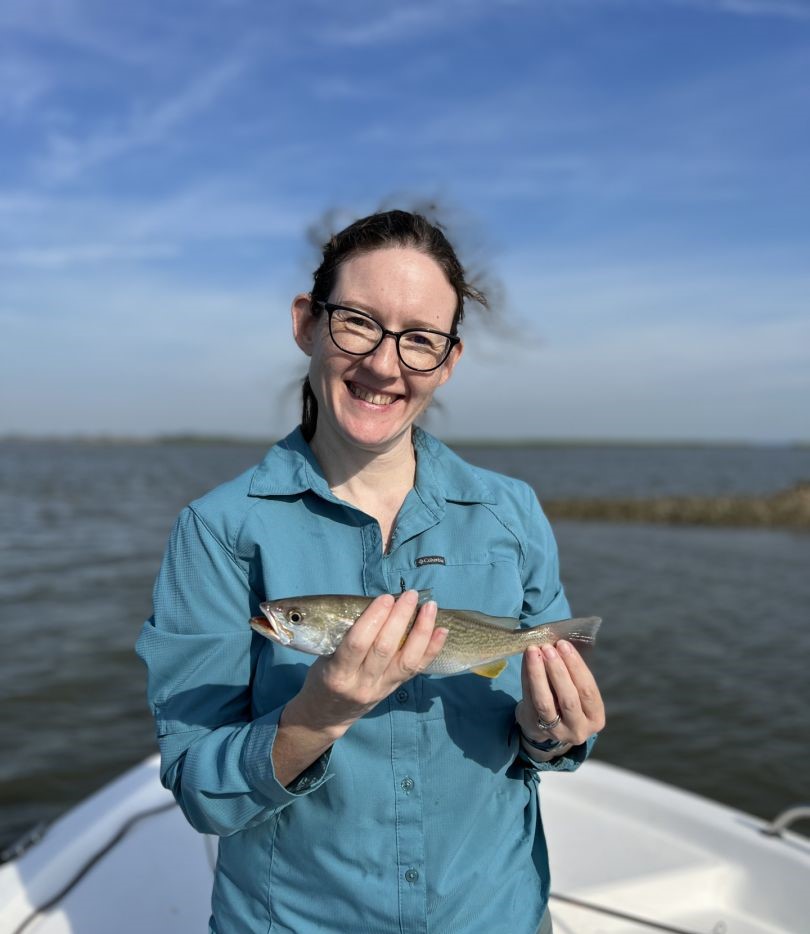 Angler holding caught fish on boat in Darien GA waters