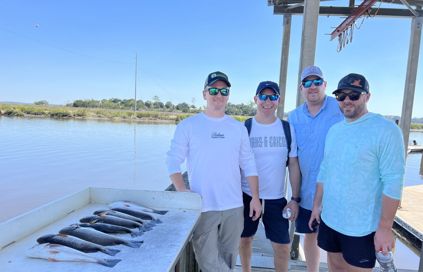 Successful fishing trip in Darien GA with fresh catch displayed on cleaning station
