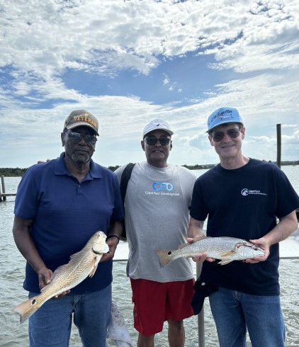 2 fishing rods with 2 fish caught in North Carolina