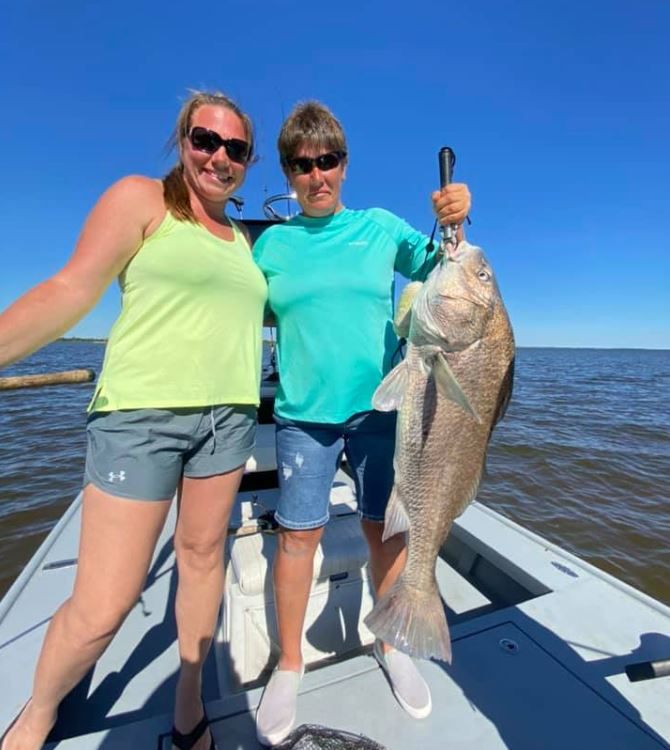 Anglers with a big 28-inch fish catch in FL