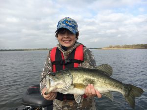 A person fishing with a rod in TX