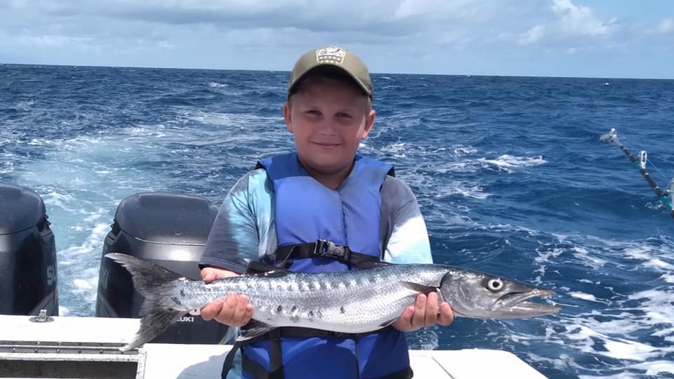 Fisherman with a great barracuda catch at Atlantic Beach