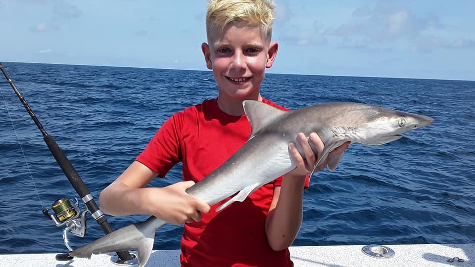 A lone fishing enthusiast in North Carolina with a 19-inch catch.