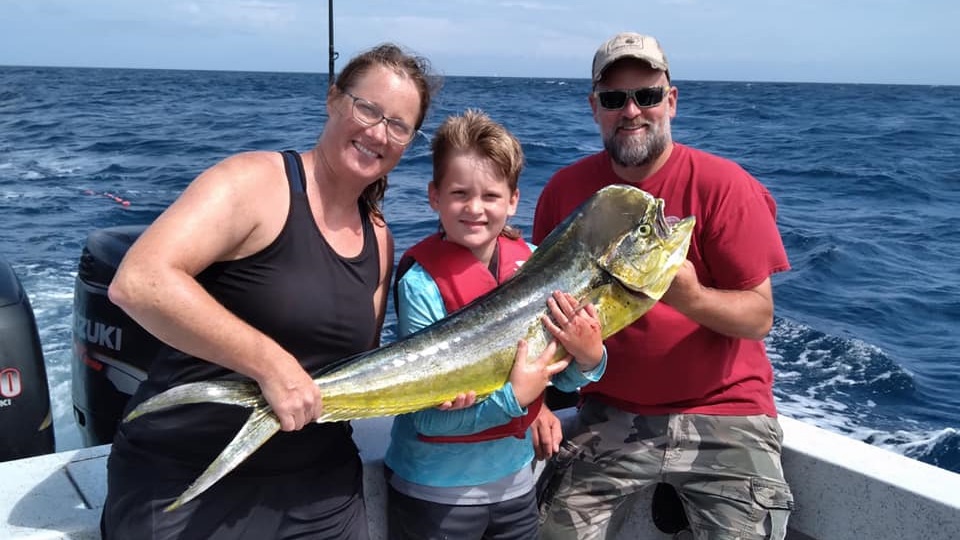 Three people fishing with rod and reel in North Carolina