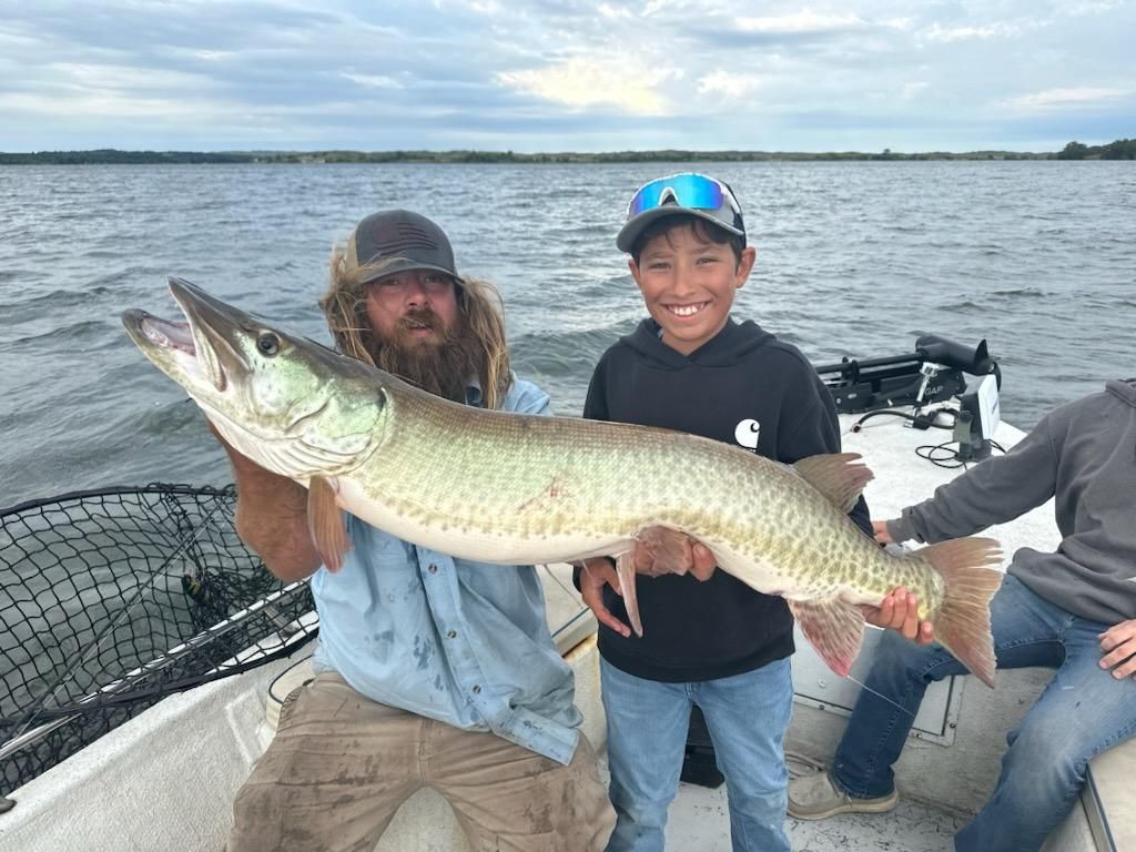 Large muskellunge fish being held on fishing boat in Valentine NE waters