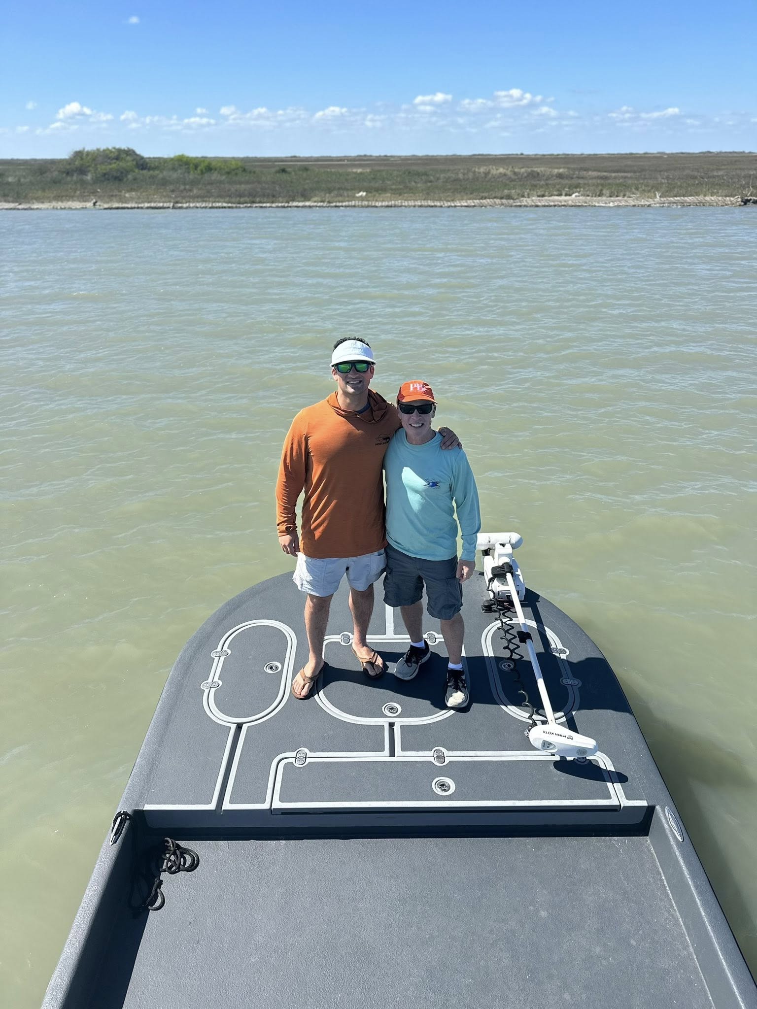Fishing boat on calm waters near Rockport TX with trolling motor and fishing equipment