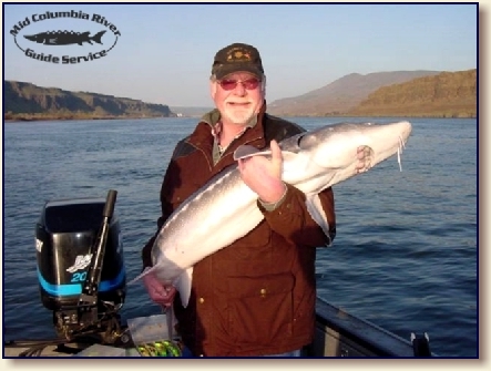 Angler with 12-inch fish in Oregon