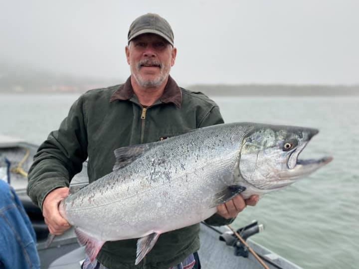 Advanced salmon fishing charter boat with captain and anglers in Gold Beach Oregon waters