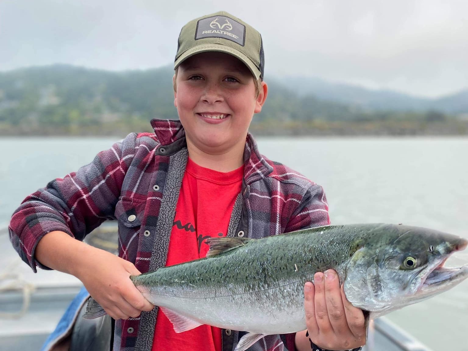Kid-friendly salmon fishing boat trip in Gold Beach Oregon with children on 21ft vessel