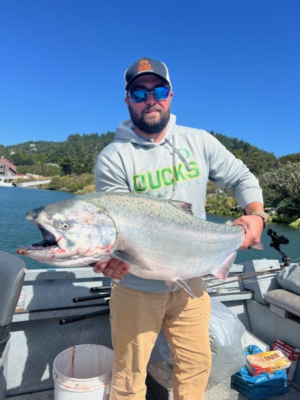 Gold Beach Oregon salmon fishing boat trip with captain and guests inshore fishing adventure