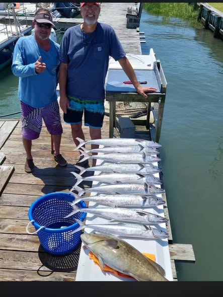 Fresh caught fish displayed on wooden dock at Atlantic Beach NC fishing trip