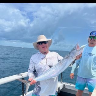 Fisherman holding a 20-inch catch in Key West
