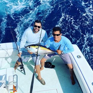 A couple fishing in Florida with a 20-inch fish