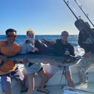 A group of 3 people fishing in Hollywood