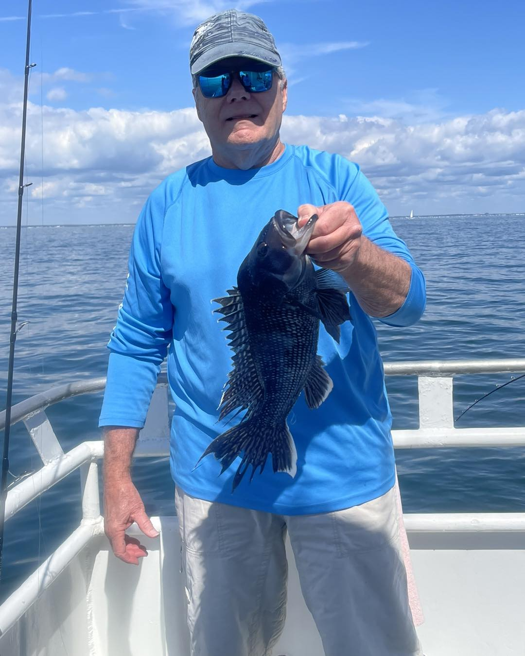 Photograph of a 14-inch sea bass caught while fishing in NJ