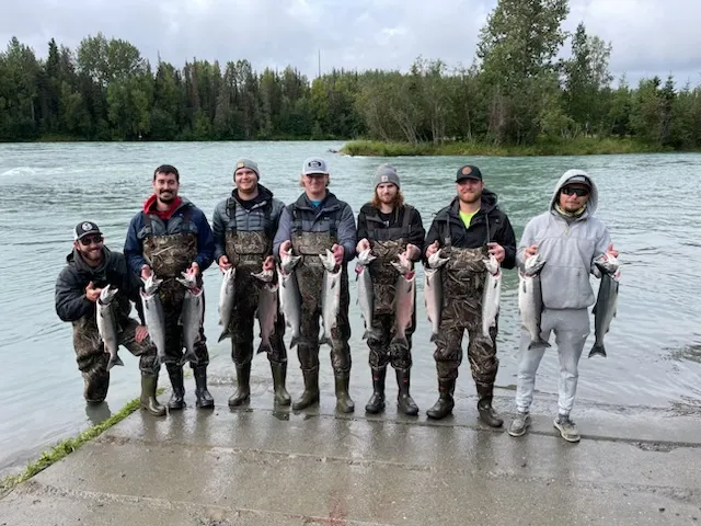 Successful fishing group displaying their catch of salmon at Kenai Alaska waterfront
