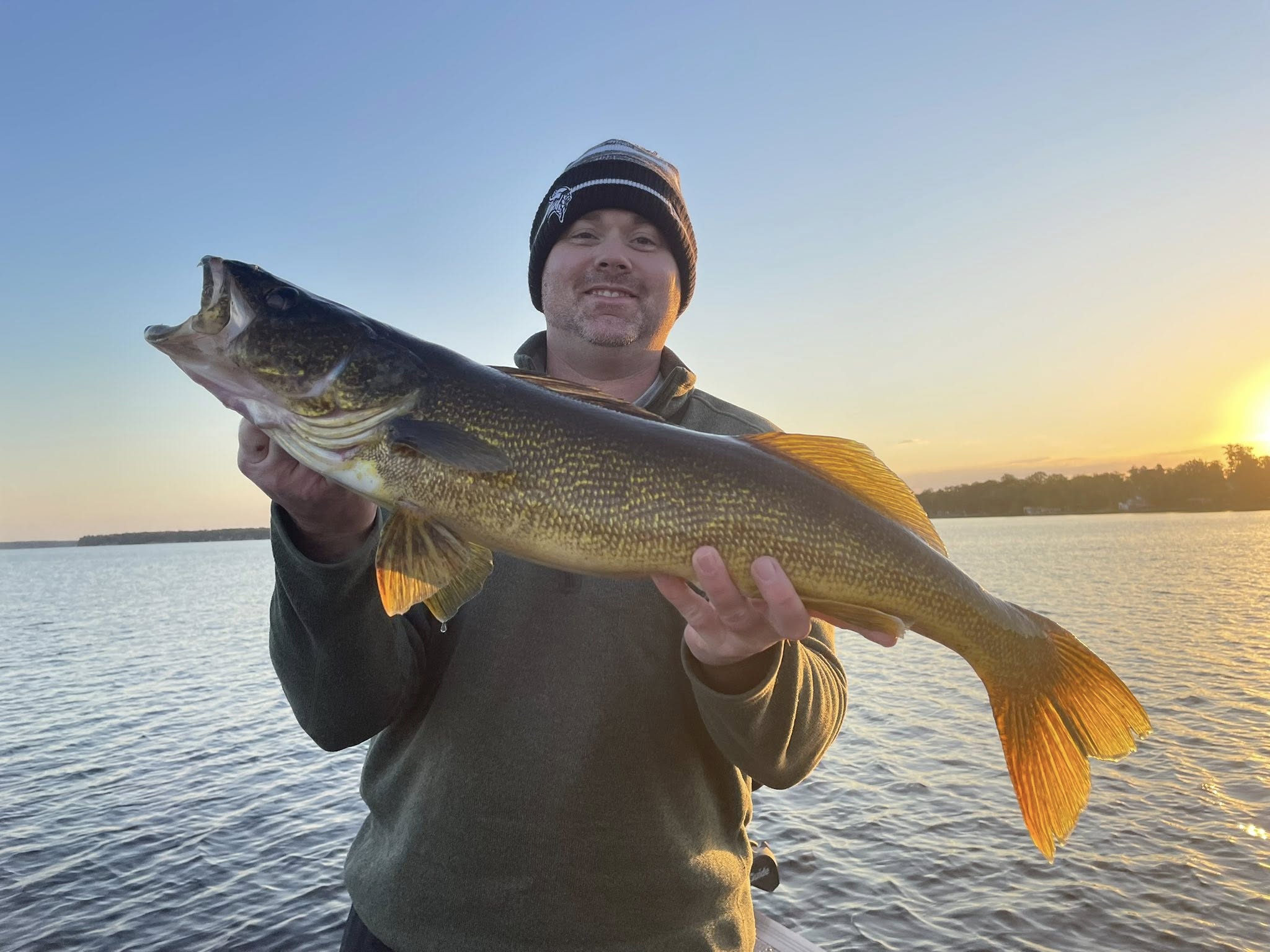 Large walleye caught fishing at Breezy Point MN during sunset on lake