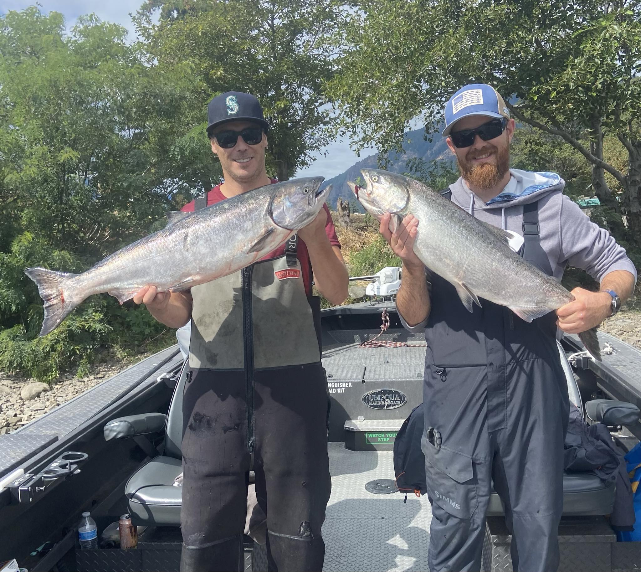 Two giant lake trout and chinook salmon caught while fishing in Washington